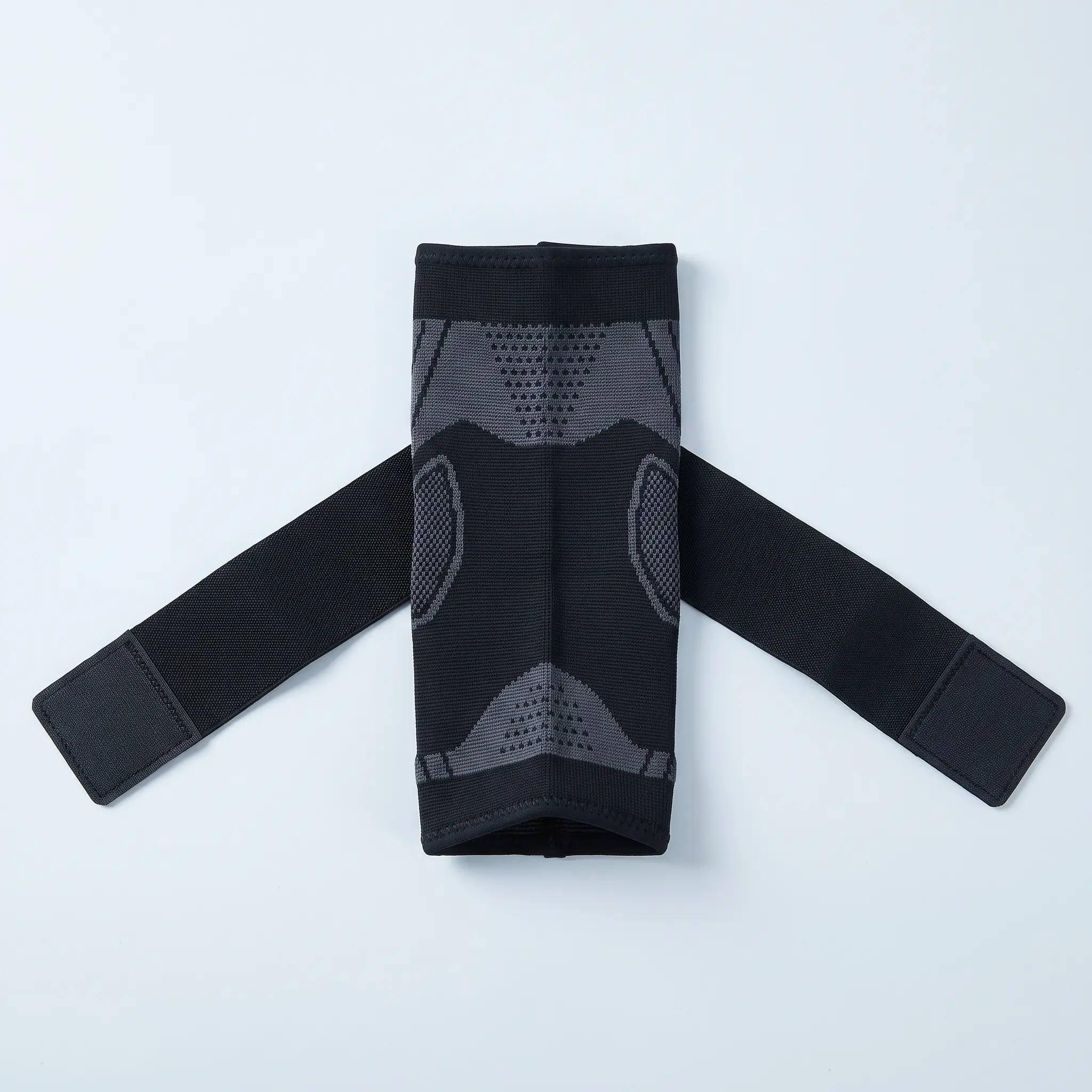 Ankle sleeve laid flat with the wrap strap extended