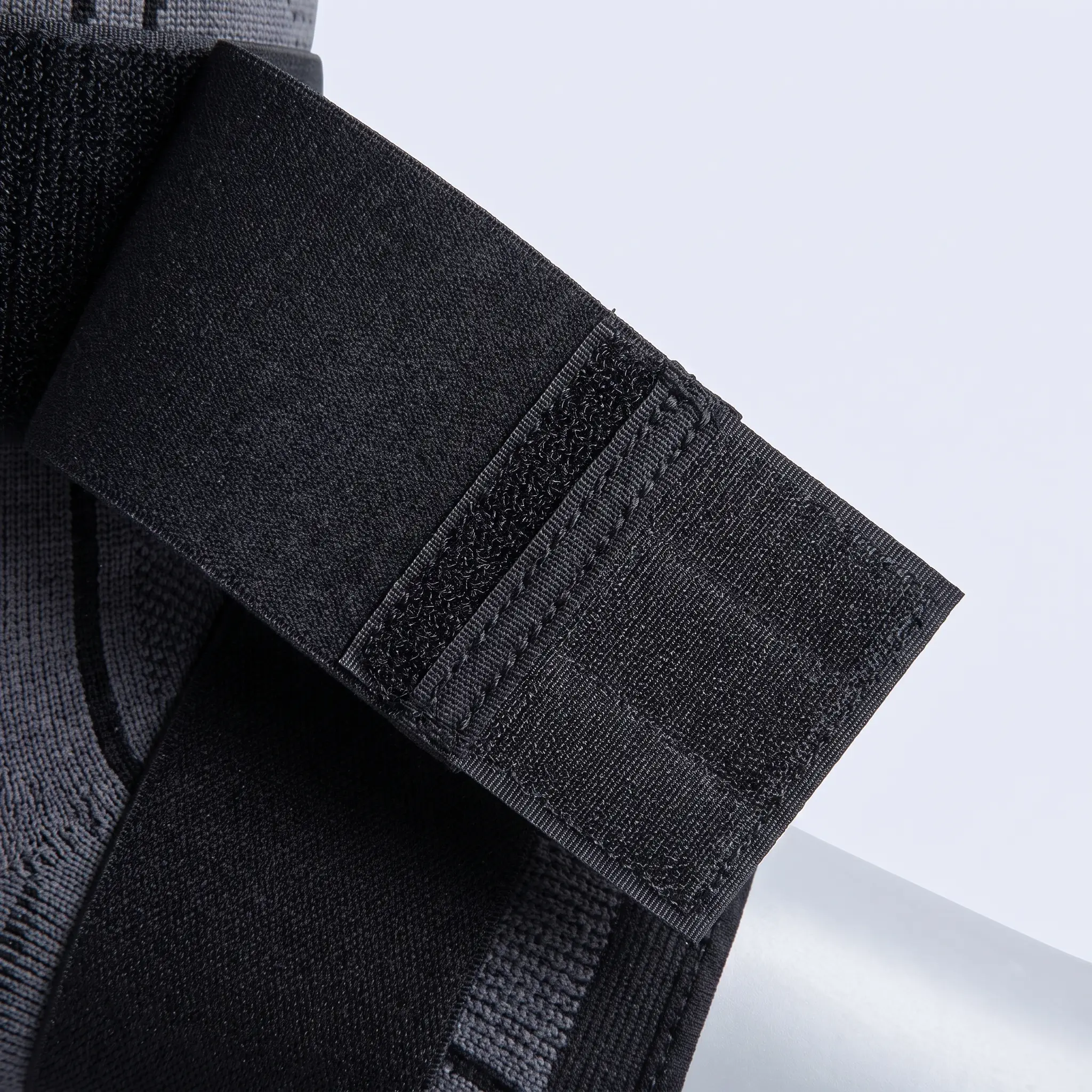 Close view of the hook-and-loop fastening tab